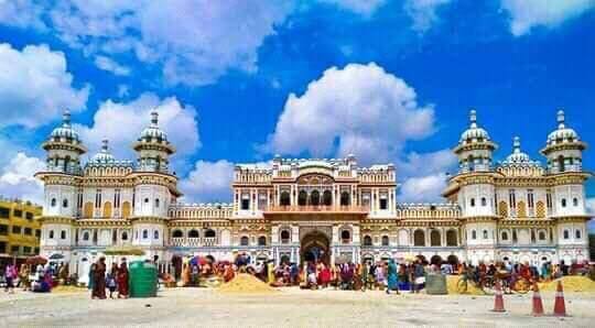 Front view of Janaki Mandir, a famous Hindu temple in Janakpur, Nepal, under a bright blue sky.