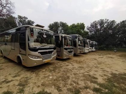 Multiple tourist buses parked, offering travel facilities for visitors.