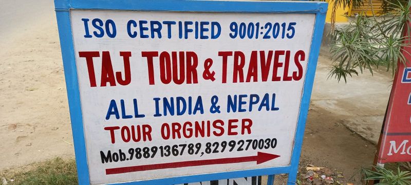 Signboard displaying the head office address of a company with complete location details, contact information, and logo, placed at the office entrance.